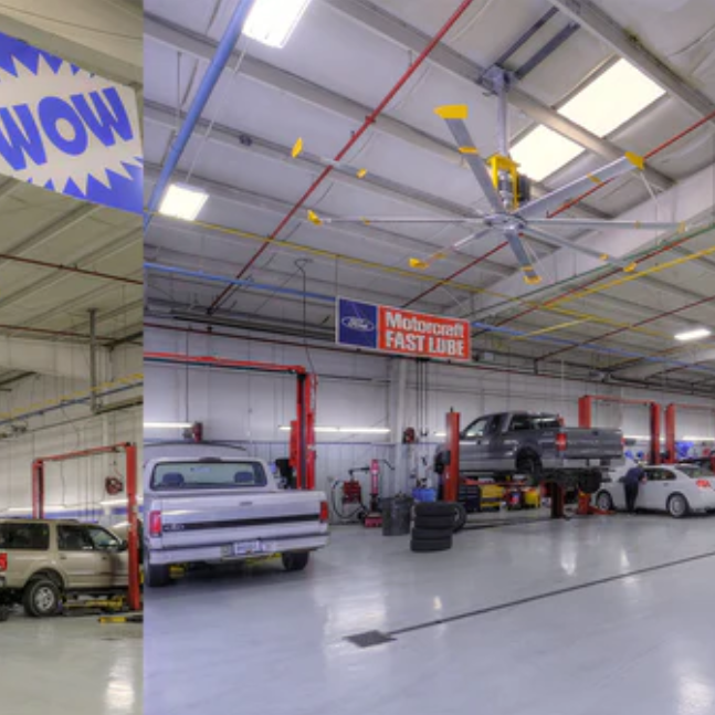 Interior of an auto shop with Big Ass Fans mounted on the ceiling.